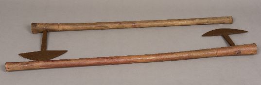 Two South African Zulu isizenze Of typical form, with curved blades. 75.5 cm and 81.