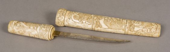 A Japanese Meiji period carved bone tanto short sword The handle and scabbard carved in the round