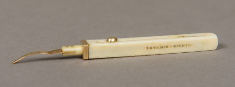 A 19th century unmarked 9 ct gold mounted ivory toothpick Of propelling form,