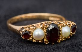 A 9 ct gold ruby and seed pearl set ring CONDITION REPORTS: Generally in good