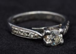 A platinum diamond solitaire ring The claw set stone approximately 0.