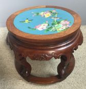 A Chinese carved hardwood urn stand