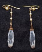 A pair of Edwardian 9 ct gold mounted quartz briolette drop earrings Each suspended on a chain with