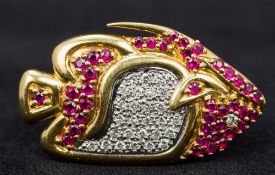 An 18 ct gold diamond and ruby brooch