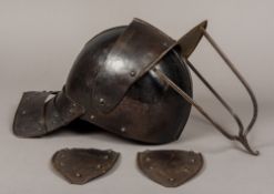 A 17th century English Civil war tri-bar lobster pot helmet The two piece skull with raised medial