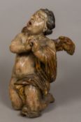 A 17th century carved wooden figure of a