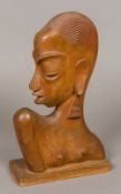 A carved wooden bust of a stylised Afric