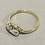 A 9 ct gold diamond set crossover ring