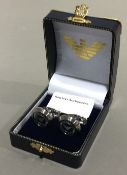 A pair of cufflinks inscribed Emporio Armani