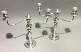 A pair of plated candelabra