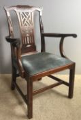 A George III mahogany elbow dining chair with fret carved decoration