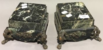 A pair of gilt metal mounted marble urn stands