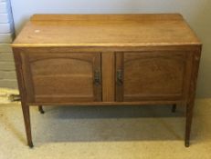 An early 20th century oak two door cupboard