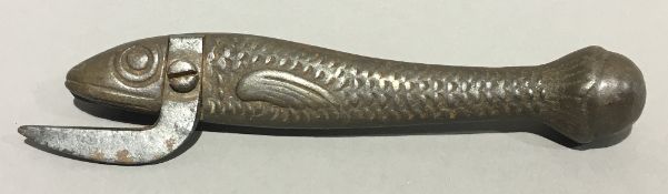 An unusual Victorian cast iron tin opener formed as a sardine