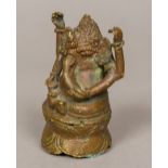 An Indian bronze figure of Ganesh, primitively cast. 8 cm high.