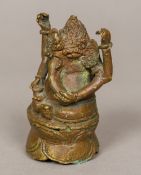 An Indian bronze figure of Ganesh, primitively cast. 8 cm high.
