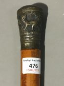 A 19th century walking stick with an Indian embossed metal knot