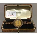 An early 20th century 9 ct gold cased lady's wristwatch, of octagonal form,