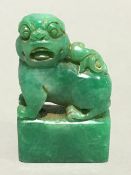 A Chinese carved jade fo dog seal