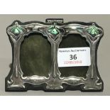 A small silver Art Nouveau style double photograph frame