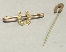 A 9 ct gold seed pearl horseshoe form brooch and a horseshoe form stick pin