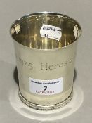 A silver beaker inscribed Here's a health unto His Majesty 1910-1935 (4.