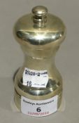 A silver pepper grinder