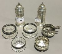 A quantity of silver and silver mounted condiments