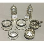 A quantity of silver and silver mounted condiments