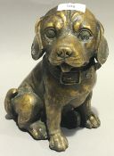 A bronze model of an adorable puppy