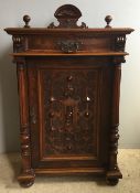 A Victorian figured walnut music cabinet