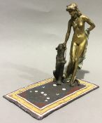 A cold painted bronze model of a nude lady with a panther