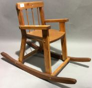 A child's wooden rocking chair