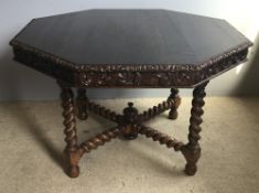 A Victorian carved oak centre table on barley twist carved stretchered legs