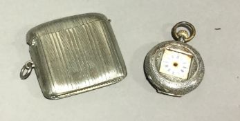 A silver vesta and a watch