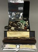 A lacquered box containing miscellaneous jewellery and watches