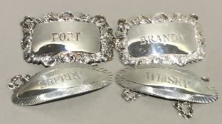 A pair of silver decanter labels, hallmarked Birmingham 1970, maker's mark of S J Rose & Son,