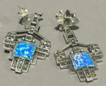 A pair of silver opal and marcasite earrings