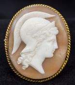 A gold mounted cameo of a classical head