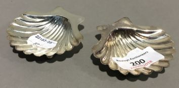 A pair of small silver shell dishes