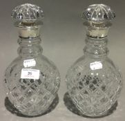 A pair of silver mounted cut glass decanters, hallmarked London 1989,