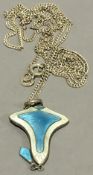 An Art Nouveau silver and enamel pendant on chain