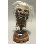 A Jivaro type shrunken head trophy model