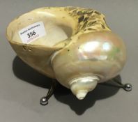 A large silver plated mounted nautilus shell