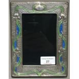 A large silver Art Nouveau style frame