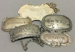 Five silver decanter labels