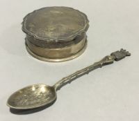 A silver trinket box and spoon