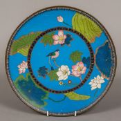 A cloisonne plate decorated with birds amongst foliage