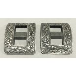 A pair of Chinese silver buckles