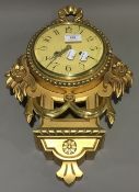 A giltwood Cartel clock